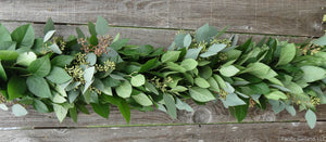 Fresh Salal and Seeded Eucalyptus Garland on a Wood Fence