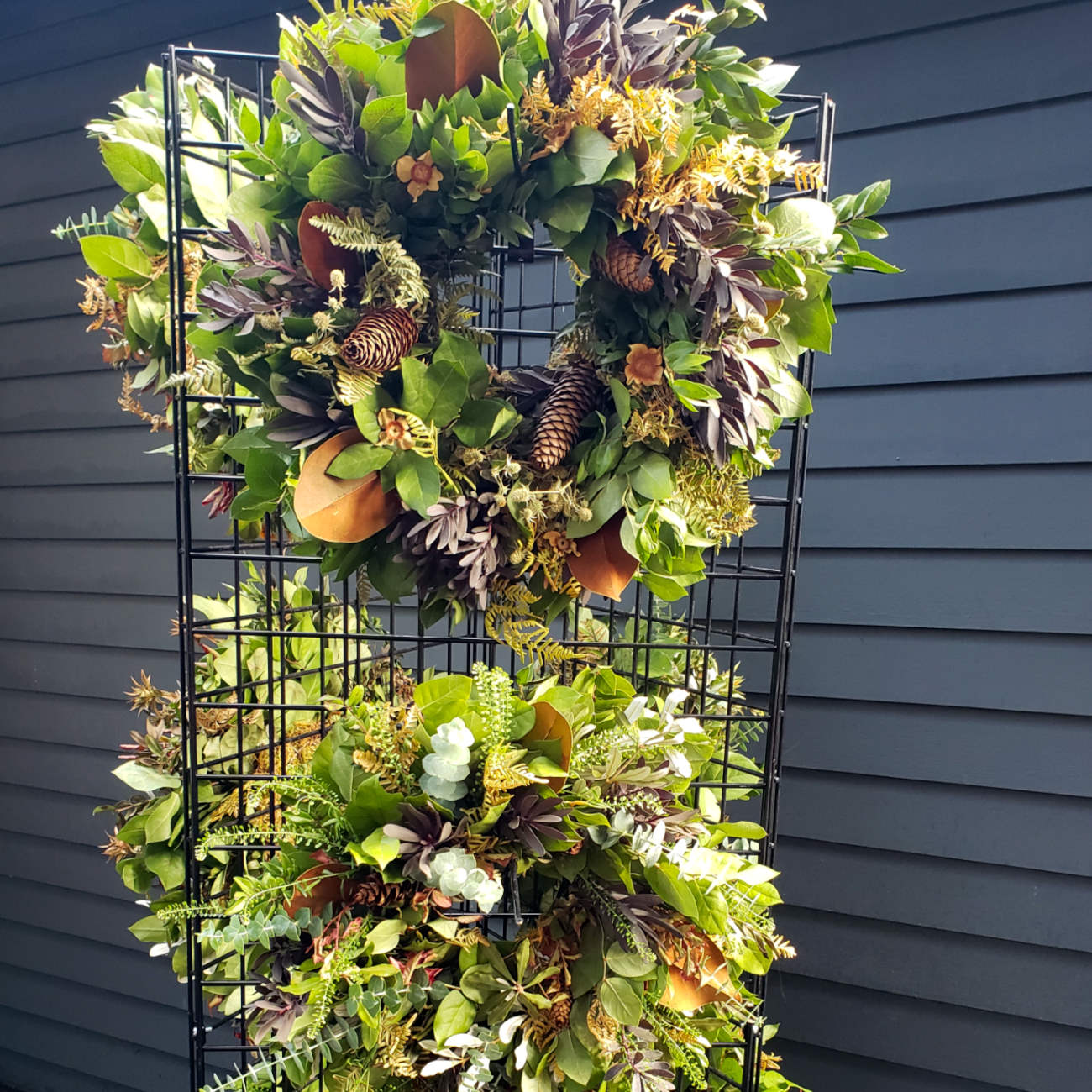rack with beautiful everlasting wreaths that look great fresh or dried